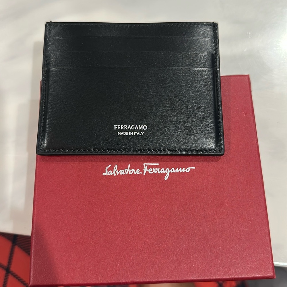 A black  ferragamo leather card case